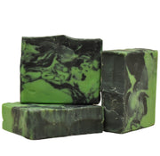 black and green soap with textured top